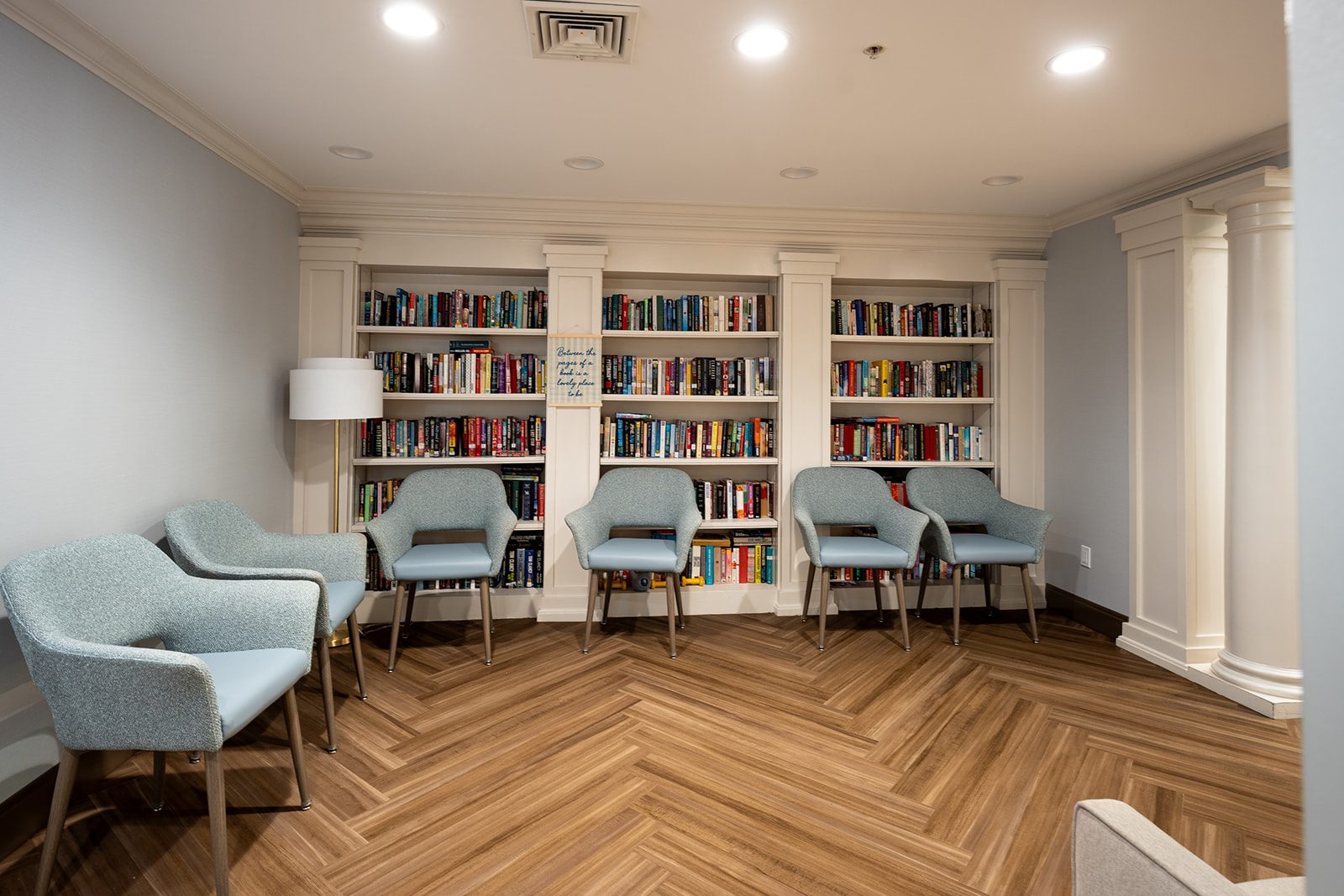 The library, lined with shelves and armchairs