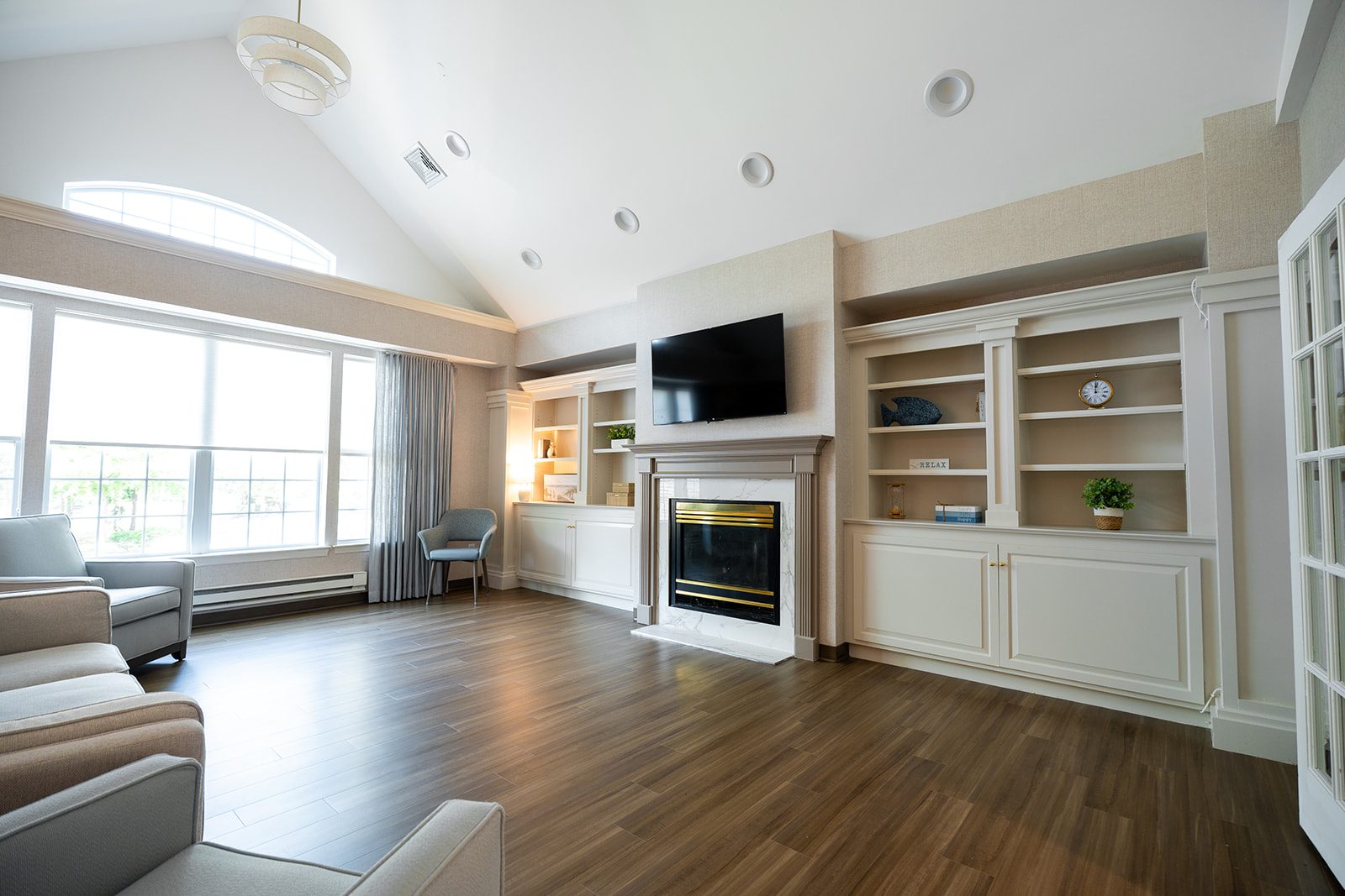 The living room, with its fireplace and built-in shelves